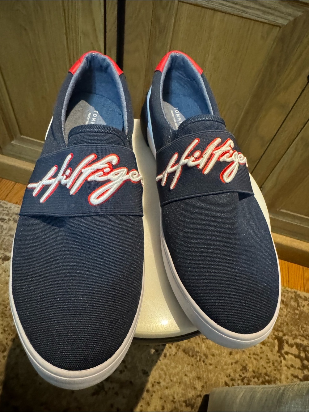 Tommy Hilfiger Navy Slip-On Mens Sneakers with Red Script.